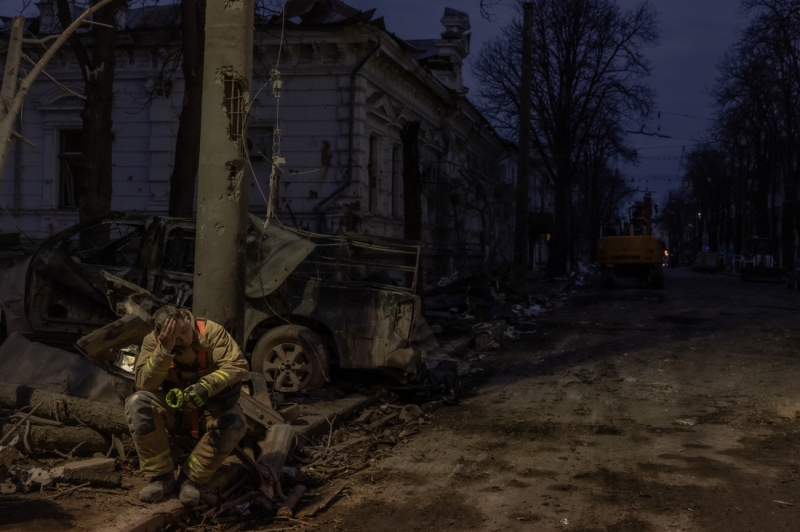 A Ukrainian rescuer takes a break