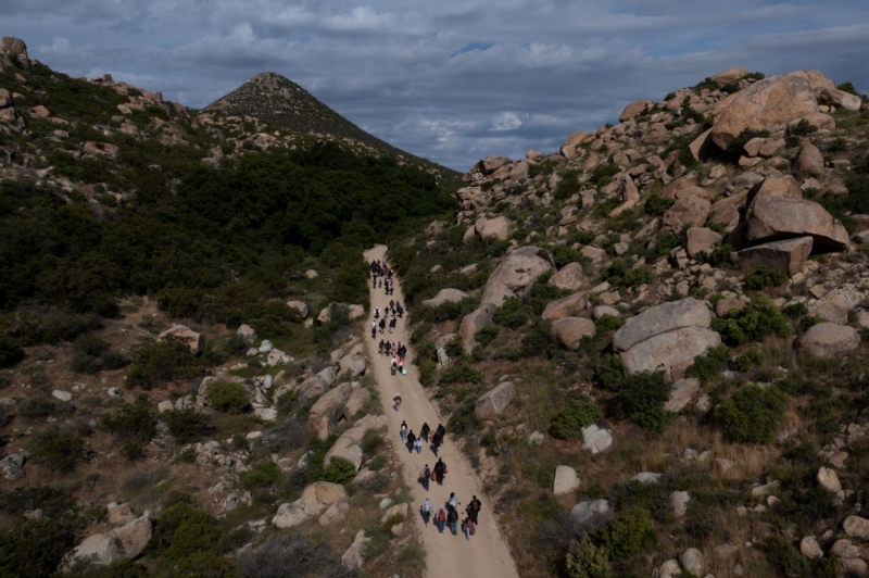 Chinese-Turkish Migrants Climb Hill